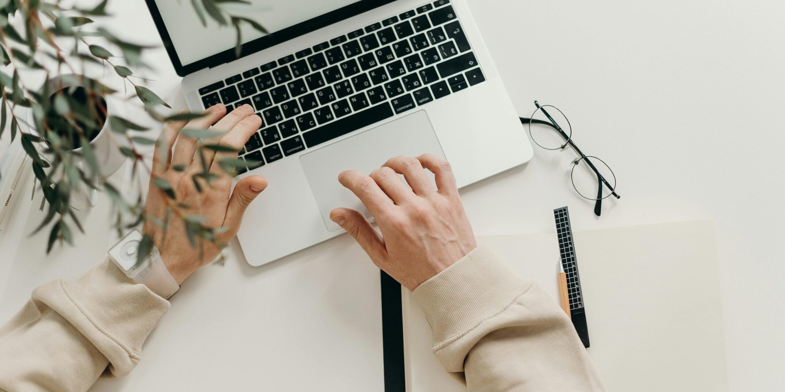 pexels-cottonbro-4065876-scaled.jpg Free An overhead view of a person working on a laptop in a minimalist home office setting. Stock Photo