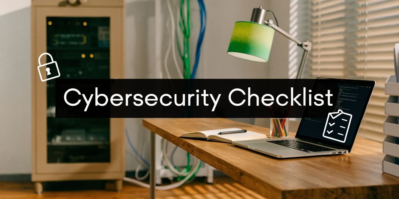 Office desk scene with a laptop displaying a 'Cybersecurity Checklist' overlay and a notebook, lamp, and cables in the background.