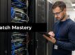 Tech professional in a data center inspecting a server rack with a tablet; banner reads Patch Mastery across the image.