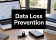 Data Loss Prevention: desk setup with laptop showing charts, stacked policy books, a USB padlock, and a smartphone.